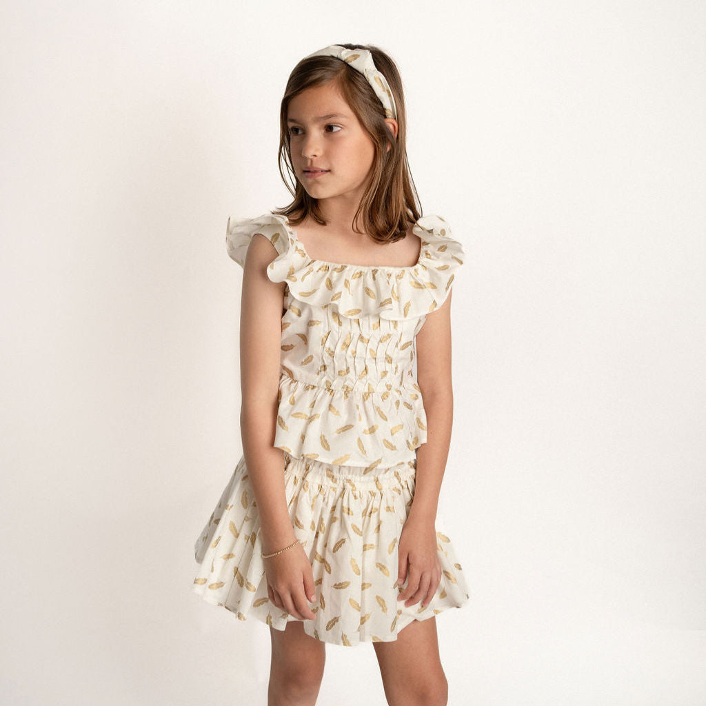 CONJUNTO BLUSA Y FALDA SHORT PLUMAS